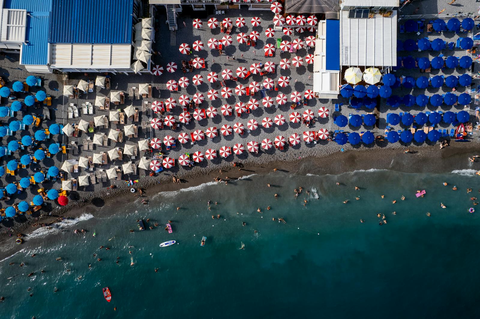 Striped cabanas and colourful umbrellas at a Forte dei Marmi bathing establishment